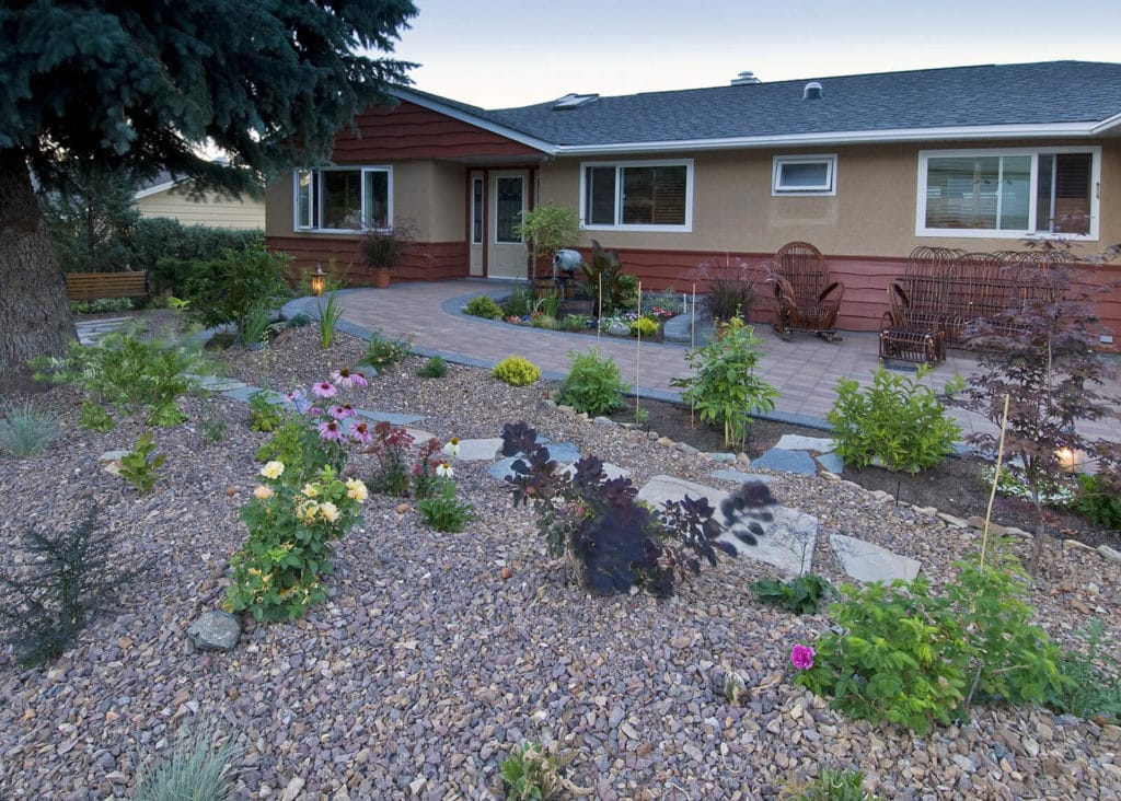 Drought-tolerant perennial garden with gravel mulch at a Kamloops home