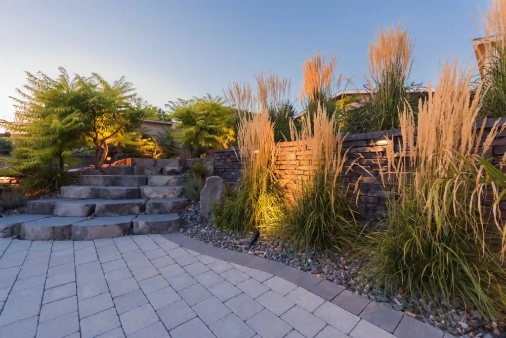 Xeriscaping front yard design with drought-tolerant plants and decorative rock in Kamloops BC