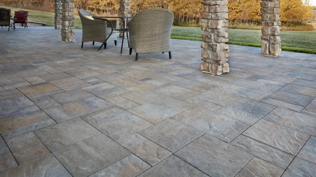 Paver patio surface inspected for spring hardscape maintenance in Kamloops