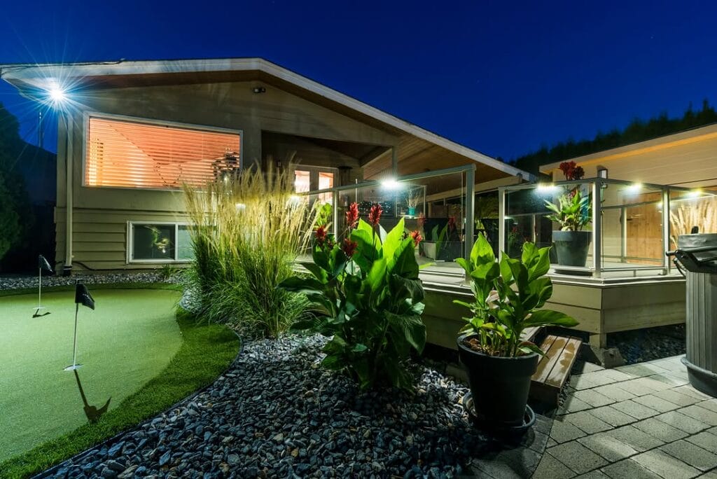 professional landscape designer reviewing outdoor lighting plan for large residential property in BC Interior