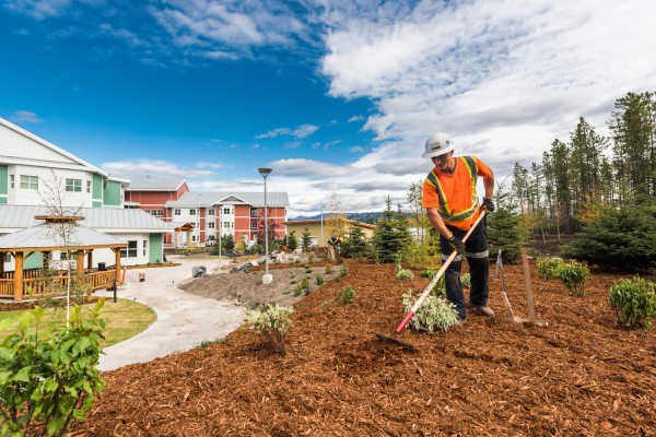 Professional strata landscaping BC service in Kamloops with garden bed mulching and maintenance